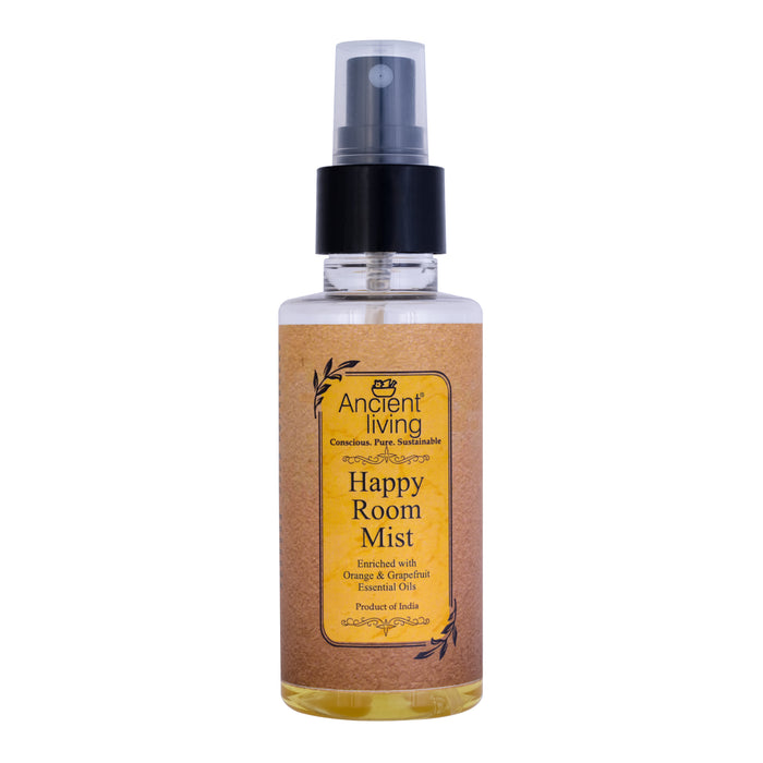 A spray bottle labeled 'Ancient Living Happy Room Mist' with a blend of orange and grapefruit essential oils.