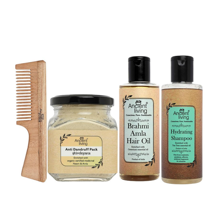 A set of hair care products including a neem wood comb, a container of anti-dandruff pack, a bottle of hydrating shampoo, and a bottle of Brahmi Amla hair oil.