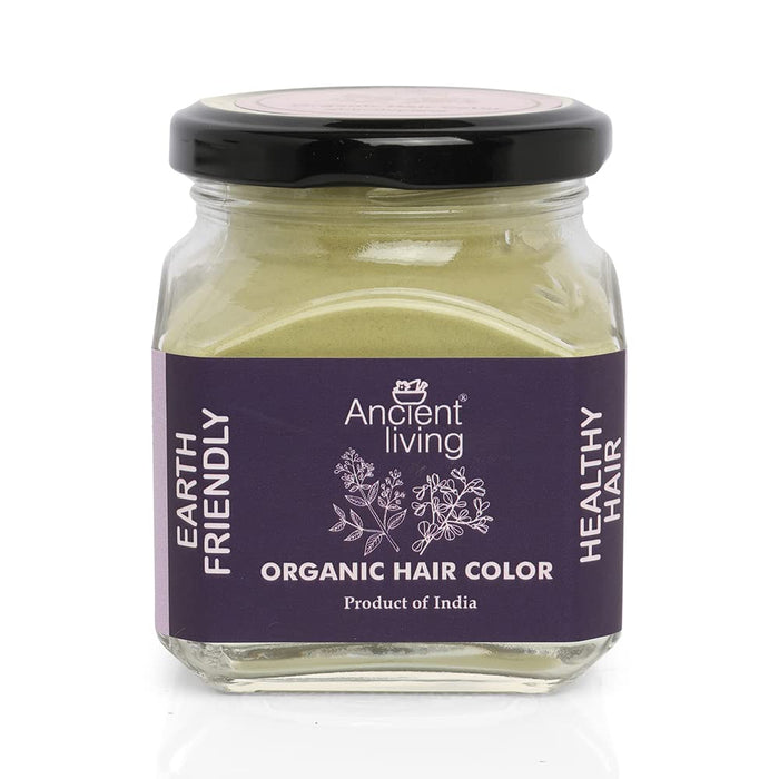 A glass jar with a black lid labeled Ancient Living Organic Hair Color, 100 gm, with a depiction of herbs and flowers on the label.