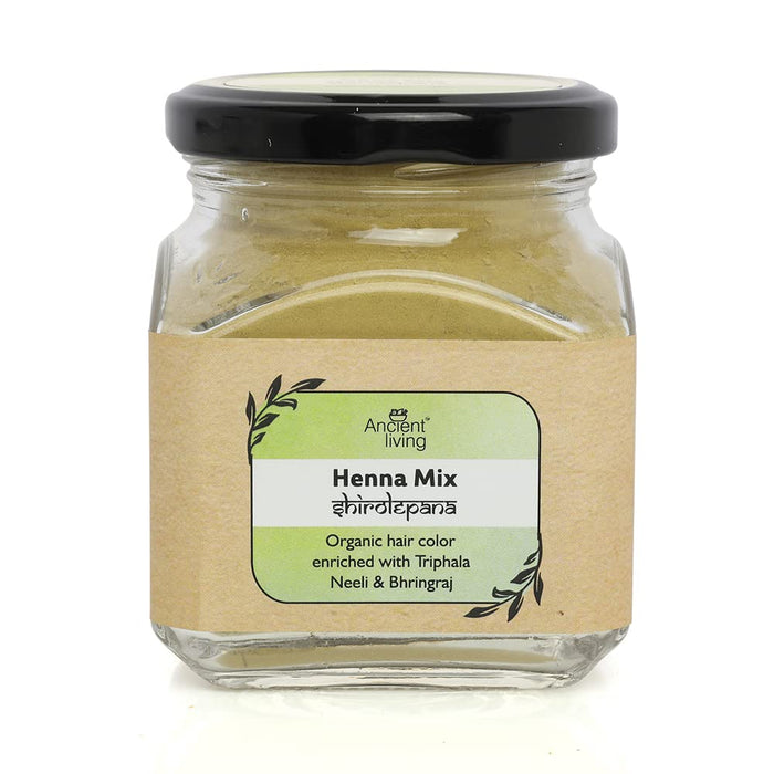 A glass jar with a black lid containing Ancient Living Henna Mix, with a label that displays the product name and Ayurvedic herbs it's enriched with.